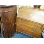 AN EDWARDIAN MAHOGANY BUREAU with shell inlay to the slope front and three drawers to the base (some