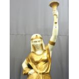 A CLASSICALLY STYLED FLOOR STANDING FIGURAL LAMP of an Egyptian girl with painted gilt detail