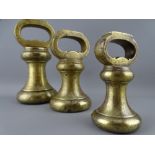 A SET OF THREE PARNALL AND SONS LIMITED BRASS BELL WEIGHTS, 7/4/2 LB fully proof stamped with