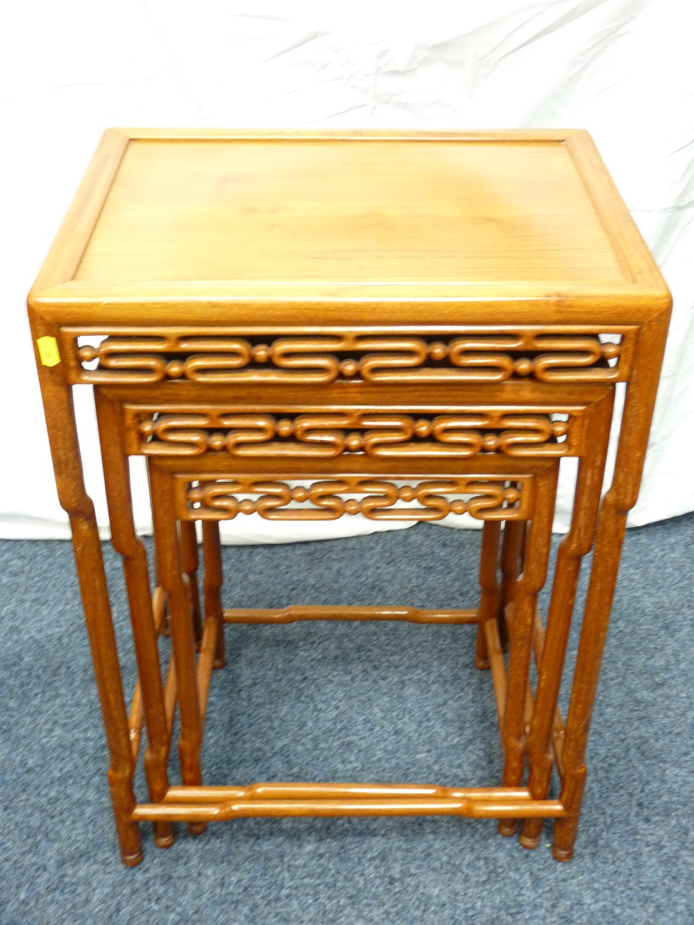 ORIENTAL HARDWOOD COFFEE TABLES, a nest of three oblong topped with patterned aprons and 'bamboo - Image 3 of 5