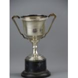 TWIN HANDLED INSCRIBED SILVER TROPHY CUP ON A PLINTH, 5 troy ozs Birmingham 1935