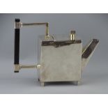 A STYLISH CUBIST FORM TEAPOT DESIGNED BY DR CHRISTOPHER DRESSER, white metal with ebonized handle,