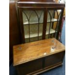 A POLISHED BLANKET CHEST and a polished two door glazed front china cabinet with back rail