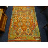 A VEGETABLE DYE WOOL CHOBI KELIM RUG, multi coloured with double border and classical central