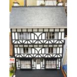 THE LADIES' SHOP - A half timbered Tudor style three storey house under a slate roof, fully