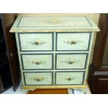 A FLORAL PAINTED CHEST OF DRAWERS with three long drawers in the continental style