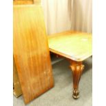 A VICTORIAN MAHOGANY PULL-OUT EXTENDING DINING TABLE with three additional leaves on substantial