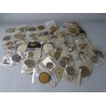 A LARGE PARCEL OF WALLETED MIXED COINAGE AND TOKENS