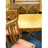 AN OAK DINING SUITE, draw leaf dining table with turned supports and cross stretcher four high
