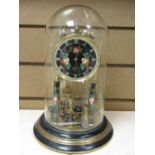 A FLORAL DECORATED BRASS & EBONY EFFECT ANNIVERSARY CLOCK in dome