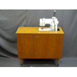 A BROTHER LS14 SEWING MACHINE IN CABINET with power lead and foot pedal, E/T, 65.5cms height,