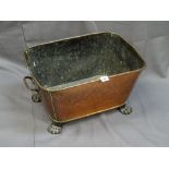 A GEORGIAN COPPER WINE COOLER/PLANTER with iron carry handles and hairy paw feet, 27cms height,
