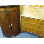AN EDWARDIAN MAHOGANY BUREAU with shell inlay to the slope front and three drawers to the base (some