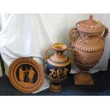 TERRACOTTA VASES, a large urn shaped vase on square plinth with a lid, twin handled with elaborate