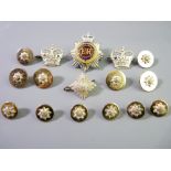 A GROUP OF MILITARY BADGES AND BUTTONS