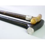 TWO VINTAGE WALKING STICKS, one horn handled, both with silver mounts, 87 and 91cms lengths