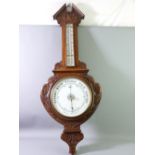 AN OAK FRAMED VINTAGE ANEROID BAROMETER WITH THERMOMETER, 84cms length