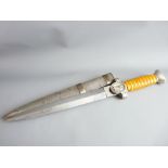 A WWII GERMAN THIRD REICH OFFICER'S DAGGER WITH SCABBARD, unmarked double edged blade and amber