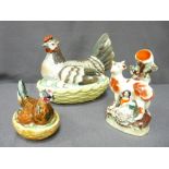 TWO STAFFORDSHIRE HEN ON NESTS and a Staffordshire spillholder of cow and lady