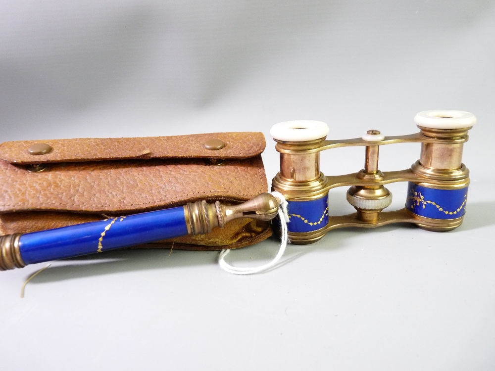 A CONTINENTAL PAIR OF FOLDING OPERA GLASSES, gilt metal with mother of pearl eye pieces, blue enamel