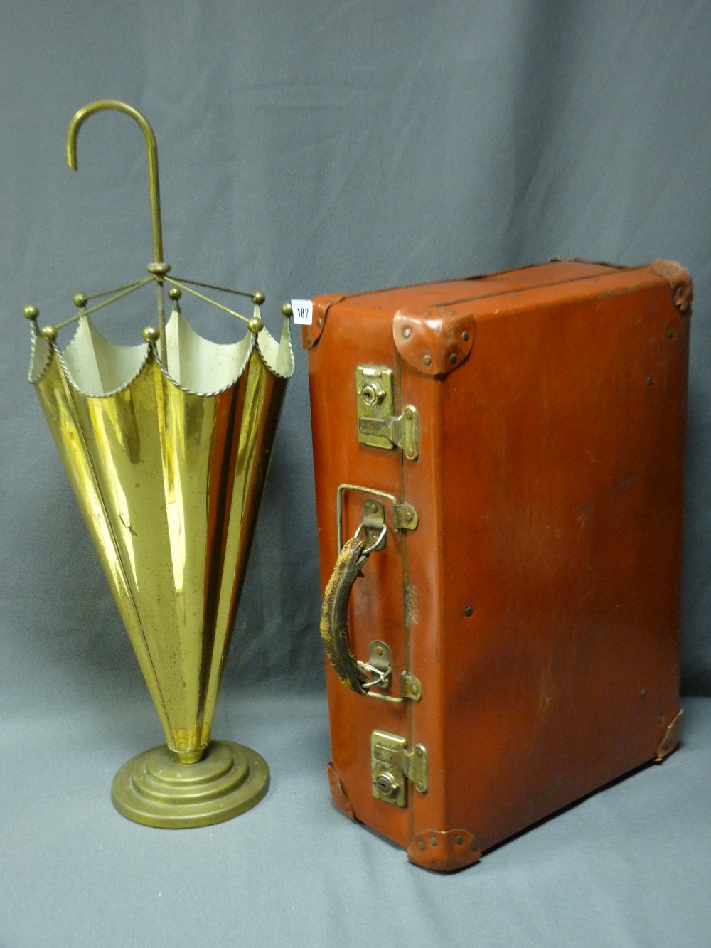 VINTAGE BRASS UMBRELLA FORM STAND and a vintage travel case