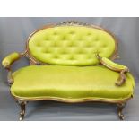 WALNUT FRAMED SOFA with oval button backed upholstery with intricate carving and similar spoon-