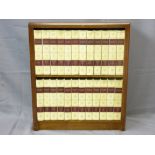 MAHOGANY BOOKCASE containing a selection of twenty four Britannia Encyclopaedia