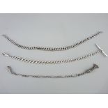 THREE SILVER FOB WATCH CHAINS, a 10.5ins example with T bar and clip an 11.5ins with graduated links