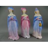 THREE CROWN STAFFORDSHIRE PORCELAIN FIGURINES in medieval dress, 17cm heights (restorations)