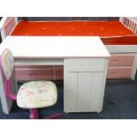 CHILD'S BED WITH PULL-OUT UNDERBED, six drawer storage unit, a white melamine desk and 'Woof Woof'