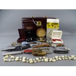 BURGUNDY TRAVELLING VANITY CASE WITH KEY containing a mixed quantity of jewellery, wristwatches,
