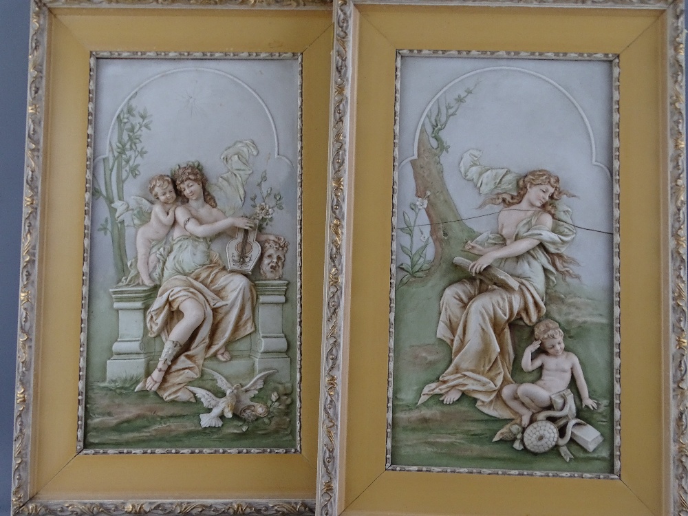 PAIR OF 20TH CENTURY CONTINENTAL PORCELAIN TYPE PLAQUES, relief moulded in the classical style, 40 x