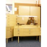 RETRO BEDROOM SUITE comprising two door wardrobe, slim chest of drawers, bedside cabinet and a