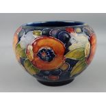 MOORCROFT, a deep blue ground 'Pomegranate' shallow circular bowl, 12cms diameter, 8cms high