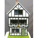 THE TUDOR HOUSE - a three storey building under a slate roof, fully furnished in period style,