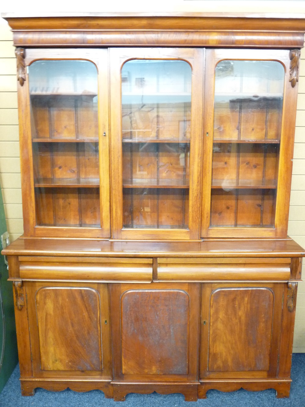 MAHOGANY CWPWRDD GWYDIR with three glazed panels over two base drawers and two flanking base