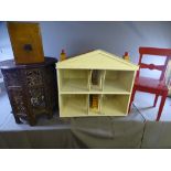 CARVED EASTERN CIRCULAR OCCASIONAL TABLE, a painted child's chair, a dolls house and a vintage set