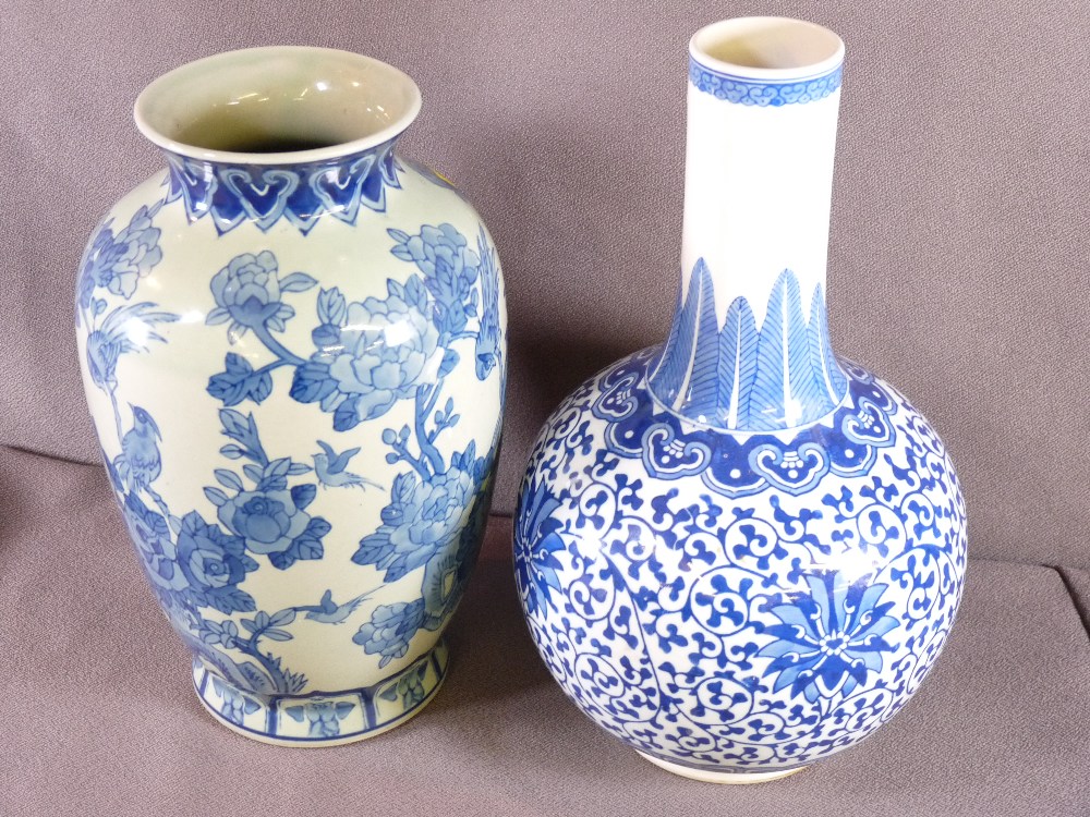 TWO CHINESE BLUE & WHITE POTTERY VASES including a Ming style bottle vase, Jingdezhen mark to the