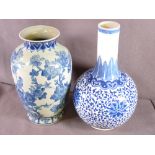 TWO CHINESE BLUE & WHITE POTTERY VASES including a Ming style bottle vase, Jingdezhen mark to the