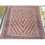 CAZUK RUG - red ground with central diamond ripple pattern and triple bordered edge, 128 x 116cms