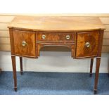 REGENCY STYLE, COMPACT BOW FRONTED SIDEBOARD on spade feet and tapered supports, 86cms height,