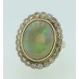 18CT YELLOW GOLD OPAL & DIAMOND CLUSTER RING the opal measuring 1.1 x 1.4cms approx., 9.2grams