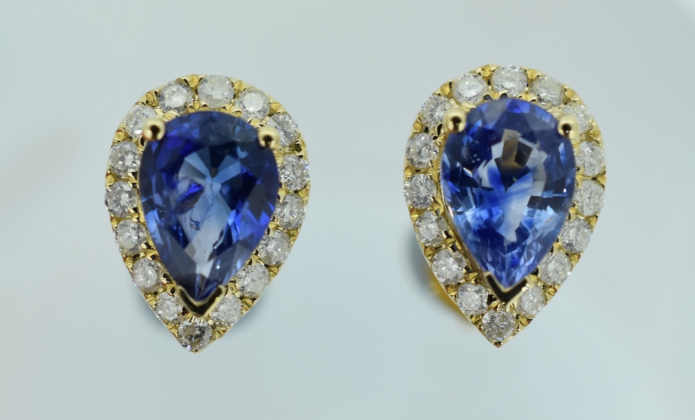 14CT YELLOW GOLD SAPPHIRE & DIAMOND EARRINGS featuring centre two-pear cut medium blue sapphire (1.