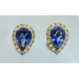 14CT YELLOW GOLD SAPPHIRE & DIAMOND EARRINGS featuring centre two-pear cut medium blue sapphire (1.