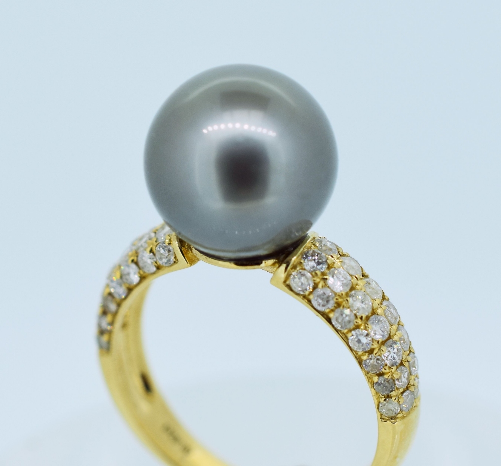 14CT YELLOW GOLD PEARL & DIAMOND RING featuring one cultured South Sea pearl with fifty-six round