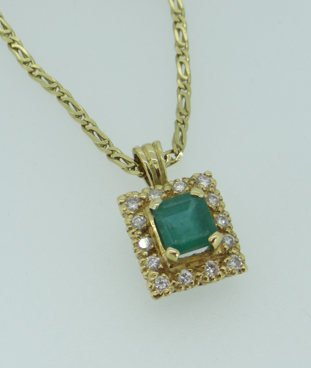 YELLOW METAL (BELIEVED 18CT GOLD) EMERALD & DIAMOND PENDANT ON 18CT GOLD CHAIN, the central - Image 2 of 2