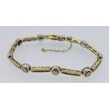 9CT YELLOW GOLD DIAMOND SET BRACELET of circular and bar design, 20cms long, 14.1grams approx.