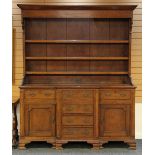 NORTH WALES BREAK FRONT OAK WELSH DRESSER having a base of four centre drawers, pair of flanking