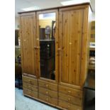 PINE EFFECT TRIPLE WARDROBE with mirrored centre door and nine drawer base