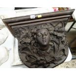 WOODEN CARVED VICTORIAN WALL DECORATION of a female's face surrounded by lilies, 44 x 53cms